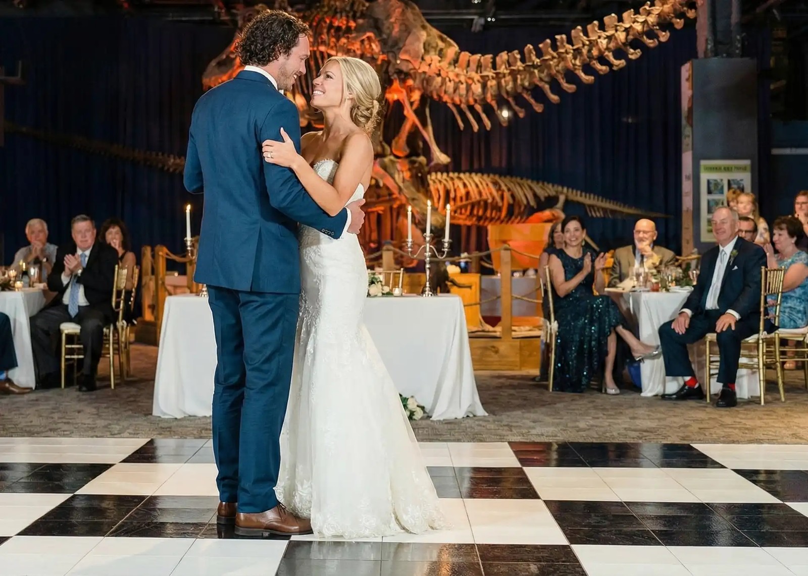 Checkerboard dance floor set up under a clear tent at an outdoor St. Louis wedding reception