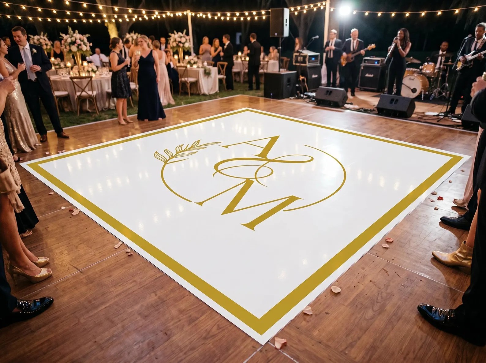 Custom printed vinyl wrap dance floor with couple's initials at a St. Louis wedding