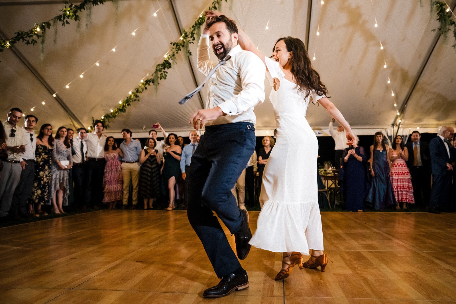 Couple sharing their first dance on a dance floor at an elegant wedding reception in St. Louis