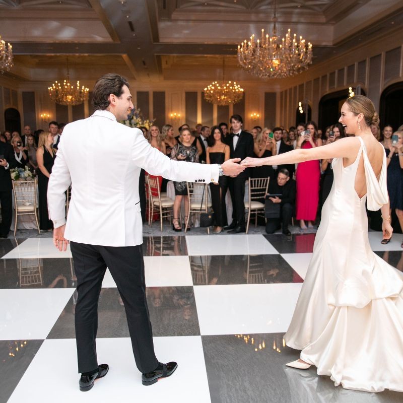 Checkerboard dance floor set up at a unique venue reception in St. Louis